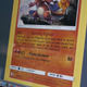 A Charmander card being typed out on screen.